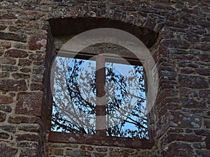 Old stone window of castle ruin Burg Zavelstein located in Bad Teinach-Zavelstein, Black Forest, Germany.