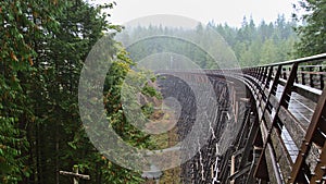 Mystic view of restored wooden railroad bridge Kinsol Trestle, spanning Koksilah River, on Vancouver Island, Canada. photo