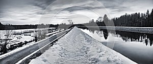 Mystic winter landscape in black and white - trail along the is