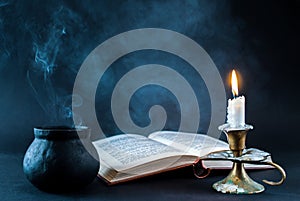 Mystical Flames: Burning Candle, Smoky Pot, and Open Book