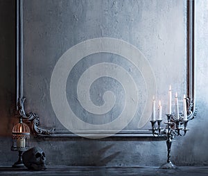 Mystical Halloween still-life background. Skull, candlestick with candles, old fireplace. Horror and witchery.