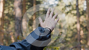Mystical hand movements. Stock. Man passes hand mystically in air one background of forest. Movement of hand in air