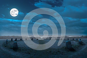 A full moon night over a historic stone circle in Cornwall, southern England.