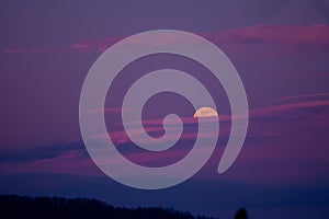 Mystical landscape with full moon rise in the cold season