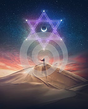 Mystical person in the desert, wears a hero cape, watching the night sky seeking the star of David symbol. Mysterious phenomena, photo