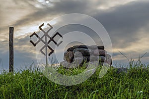 Mystical place in nature. Stone altar, ancient pagan symbols, mystic cloudy sky.