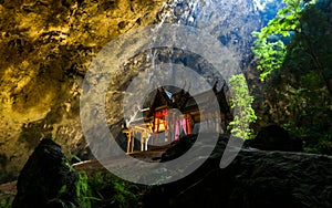 Mystique view to the Phraya Nakhon Cave with the Khuha Kharuehat Pavilion illuminated by Sun through the Hole in the Rocky Top