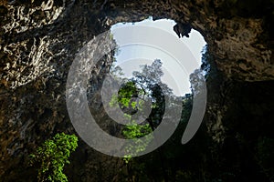 Mystique view to the Phraya Nakhon Cave with the Khuha Kharuehat Pavilion illuminated by Sun through the Hole in the Rocky Top