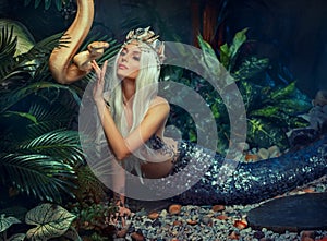 myth creature Nagga woman touches white milk Boa constrictor albino snake. Fantasy asp girl, blonde long hair looks at