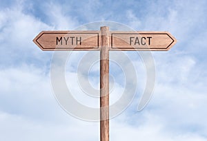 Myth or fact concept. Opposite directions on signpost