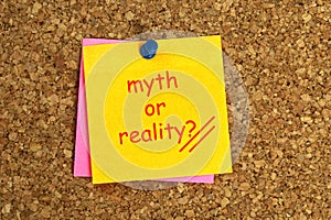 Myth or reality postit on cork