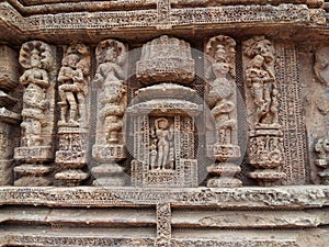 Mythical characters  lovemaking scenes and dancing women in stone at Sun Temple  Konark  India