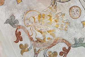 The mythological bird Phoenix feeding his nestlings with his own blod, an ancient mural