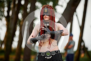 Mythological dancing girl faun on green lawn in public park outdoor art dancing event