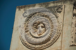 Mythological face carved in marble block at the Roman Forum in Merida