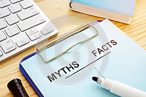 Myths and facts list with pen. Fake news concept photo