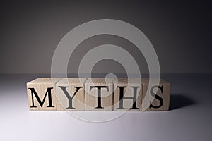 Myths word written on wood block. myths text on table, concept