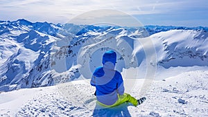 Mölltaler Gletscher - A skier sitting on the snow