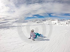 Mölltaler Gletscher - A snowboarder girl sitting on the slope