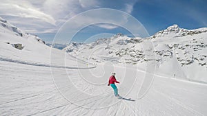 Mölltaler Gletscher - A snowboarder going down the slope