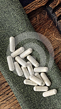 N-acetyl cysteine NAC supplement capsules  on burlap rag. immune prevention care concept