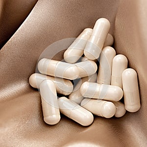 N-acetyl cysteine NAC supplement capsules on silk background. immune prevention care concept