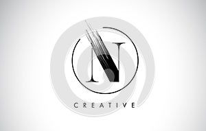 N Brush Stroke Letter Logo Design. Black Paint Logo Leters Icon.