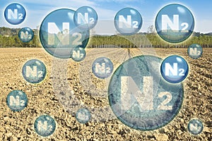 N2 nitrogen gas is the main constituent of the earth\'s atmosphere - concept with nitrogen molecules