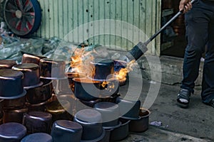 N4w copper pots and kettles are thermally tempered using propane blowtorch on streets of Turkey