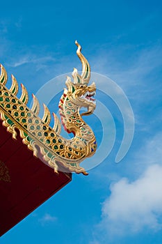 Na-ga on temple roof and blue sky