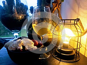 A glass of white wine in a warm summer evening photo