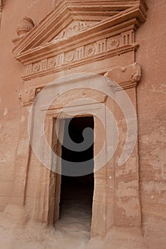 Nabatean tomb in MadaÃÂ®n Saleh archeological site, Saudi Arabia photo