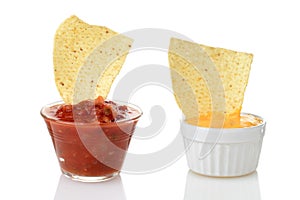 nacho chips dipped in salsa and cheese