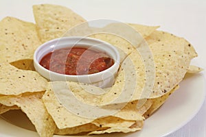 Nacho chips with salsa photo