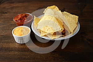 Nacho chips with salsa and cheese