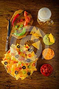 Nachos with dip and beer