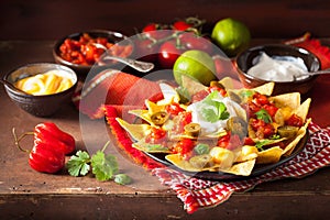Nachos loaded with salsa, cheese and jalapeno