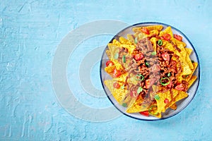 Nachos, Mexican food, tortilla chips with beef and fresh vegetables