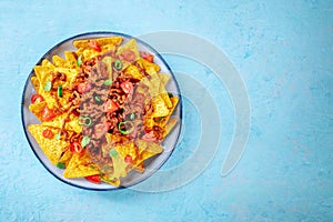 Nachos, Mexican food, tortilla chips with beef and fresh vegetables