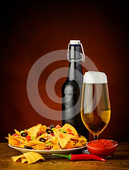 Nachos, salsa dip and beer