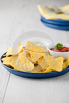 Nachos with salsa and sour cream