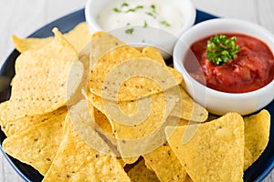 Nachos with salsa and sour cream