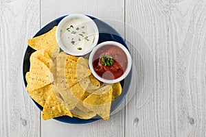 Nachos with salsa and sour cream