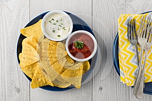 Nachos with salsa and sour cream