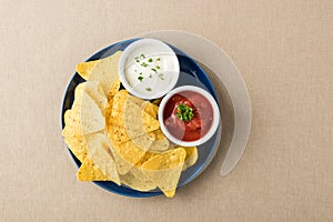 Nachos with salsa and sour cream