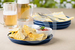 Nachos with salsa and sour cream dips