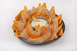 Nachos tortilla chips with cheddar sauce isolated white background