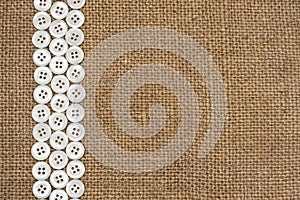 Nacre buttons on fabric texture