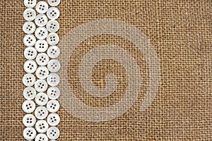 Nacre buttons on fabric texture photo