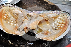 Nacre with raw pearl photo